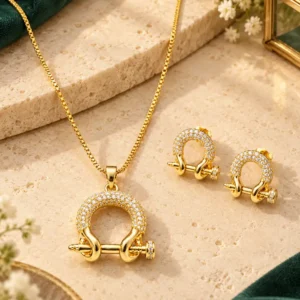 Aurelia anti-tarnish gold-plated crystal link pendant necklace with matching stud earrings